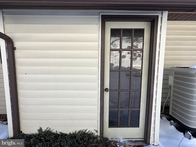 doorway to property with central AC