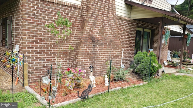 view of property exterior featuring brick siding