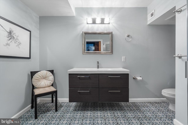 bathroom with vanity and toilet