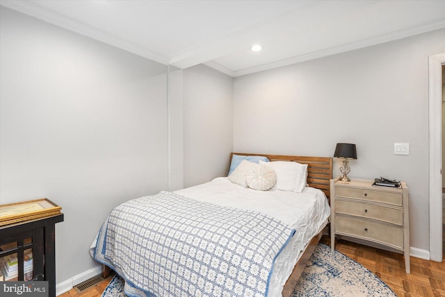 bedroom featuring parquet floors and crown molding