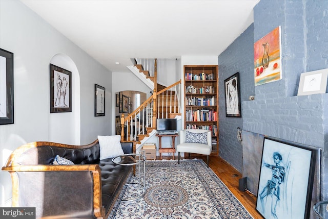 interior space with hardwood / wood-style floors and built in shelves