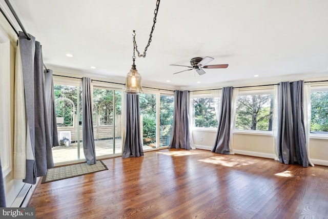 spare room featuring ceiling fan and wood-type flooring