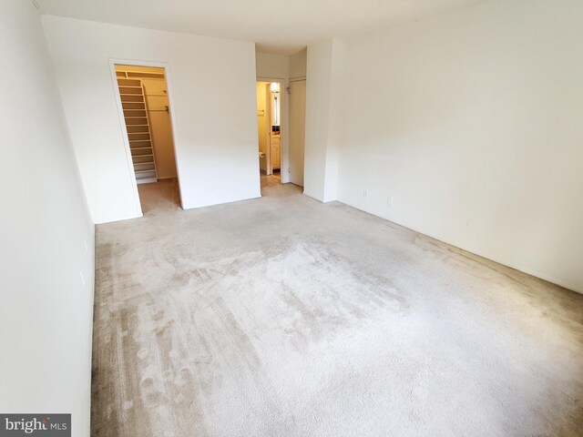 spare room with light carpet