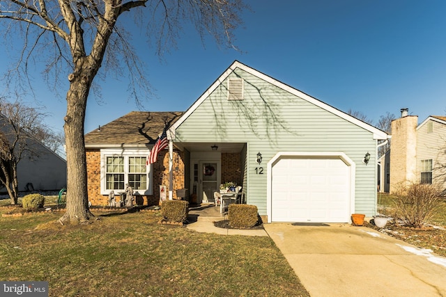 view of front of house featuring a garage and a front lawn