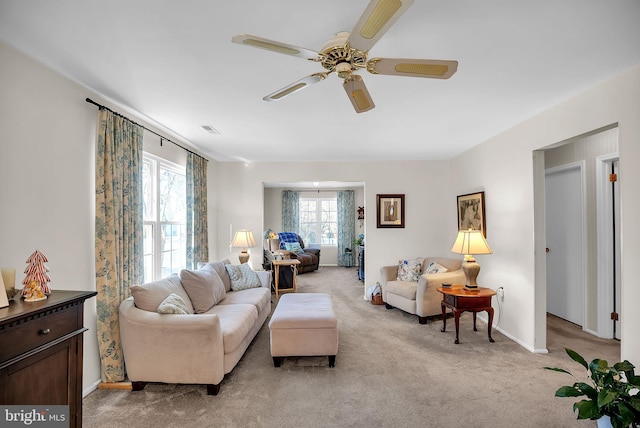 living room with light carpet and ceiling fan