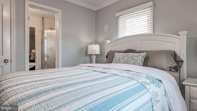 bedroom featuring ensuite bath and crown molding