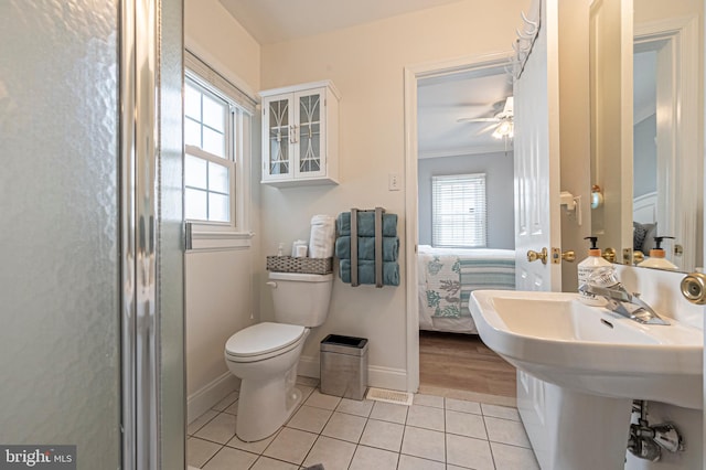 bathroom with tile patterned flooring, ceiling fan, toilet, and ornamental molding