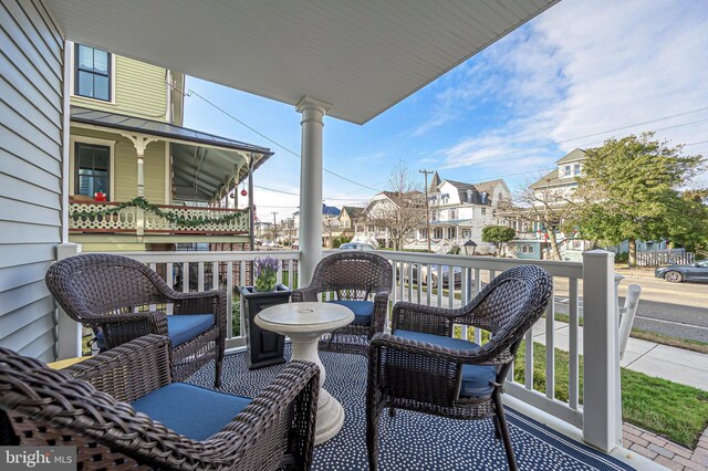 balcony featuring a porch