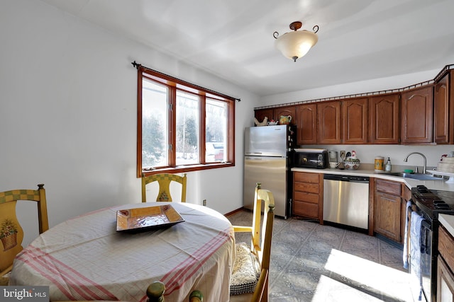 kitchen with sink and appliances with stainless steel finishes