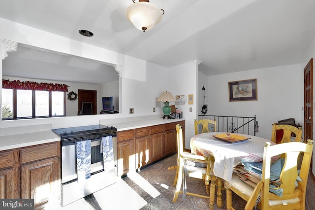 kitchen featuring stainless steel range with electric cooktop and light tile patterned flooring