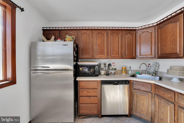 kitchen with appliances with stainless steel finishes and sink