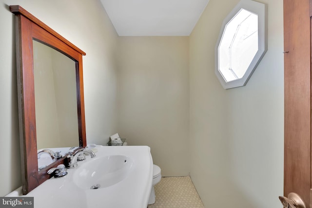 bathroom with sink and toilet