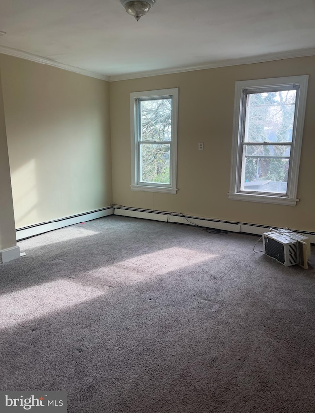 unfurnished room with baseboard heating, crown molding, and carpet