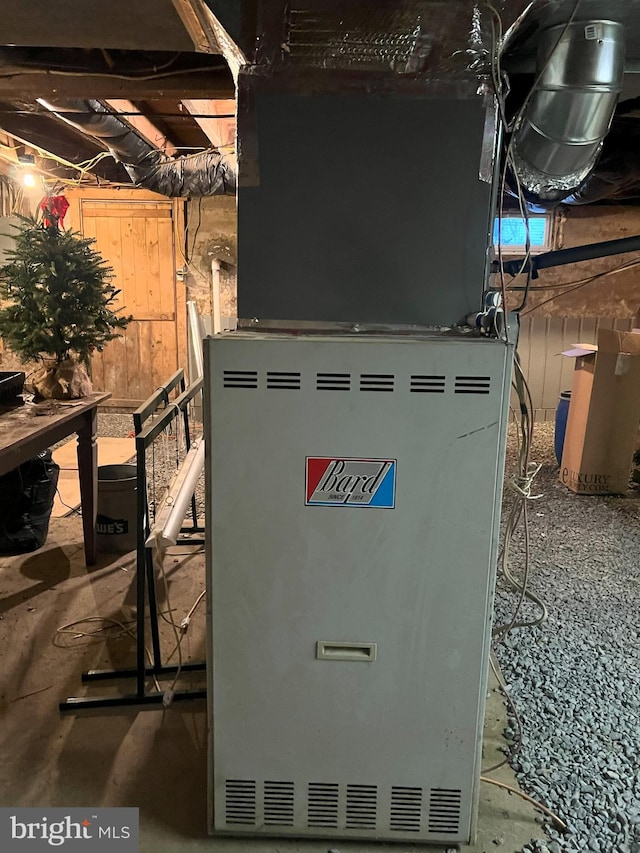 utility room featuring heating unit