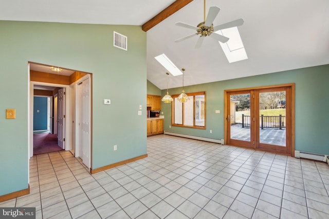 unfurnished living room with baseboard heating, lofted ceiling with skylight, ceiling fan with notable chandelier, and light tile patterned floors