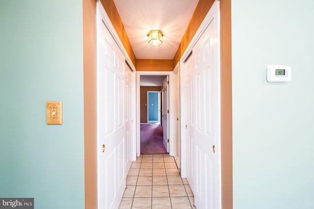 hallway featuring light tile patterned flooring