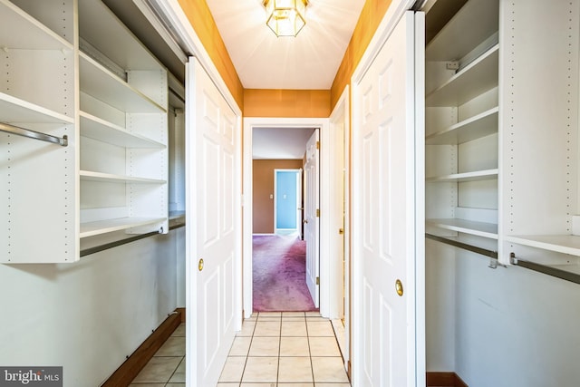 corridor with light tile patterned floors