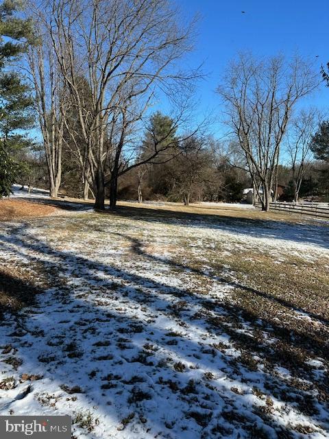 view of yard layered in snow