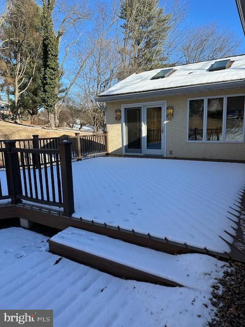 view of snow covered deck