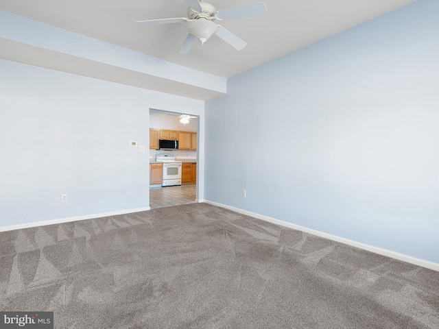 unfurnished living room featuring light carpet and ceiling fan