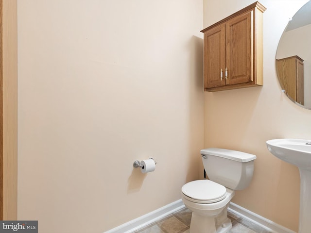 bathroom featuring sink and toilet