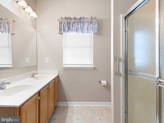 bathroom featuring vanity and an enclosed shower