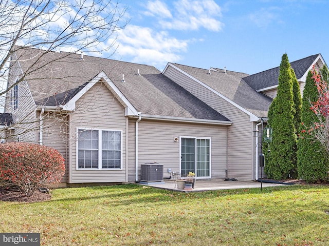 back of property with a patio, cooling unit, and a lawn