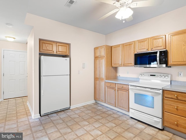 kitchen featuring ceiling fan and white appliances