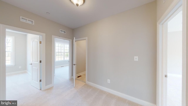 interior space featuring light colored carpet