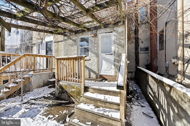 view of snow covered deck