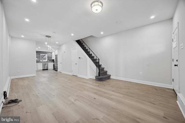 unfurnished living room featuring light hardwood / wood-style floors