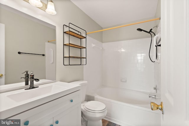 full bathroom featuring vanity, bathing tub / shower combination, and toilet