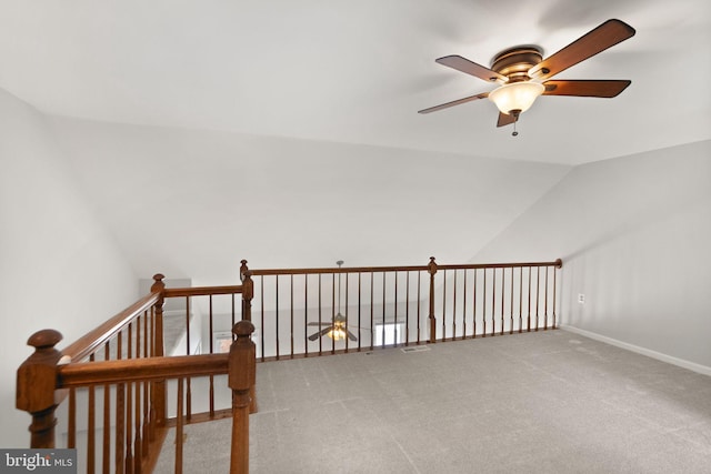 additional living space with ceiling fan, carpet floors, and vaulted ceiling