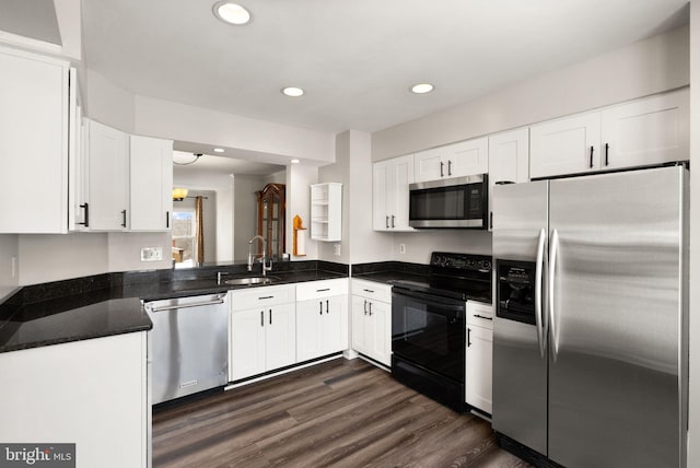 kitchen with dark hardwood / wood-style floors, sink, white cabinetry, and stainless steel appliances