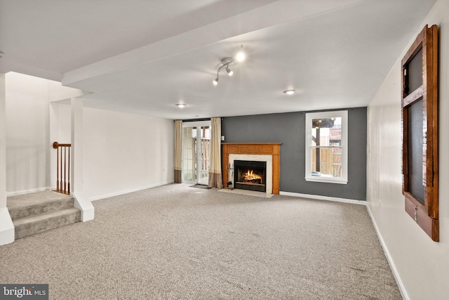 unfurnished living room with carpet floors