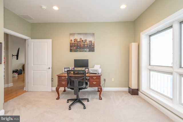 carpeted home office featuring a wealth of natural light