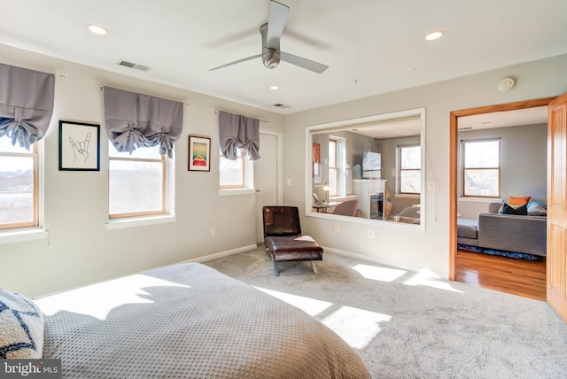 carpeted bedroom with baseboards, a ceiling fan, visible vents, and recessed lighting