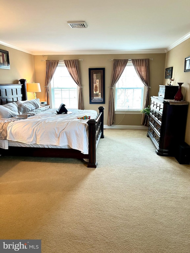 bedroom featuring carpet, crown molding, and multiple windows