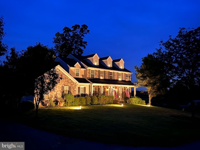 view of front of house featuring a lawn