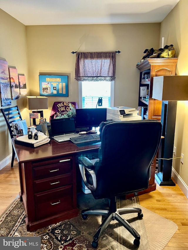 home office with light wood-type flooring