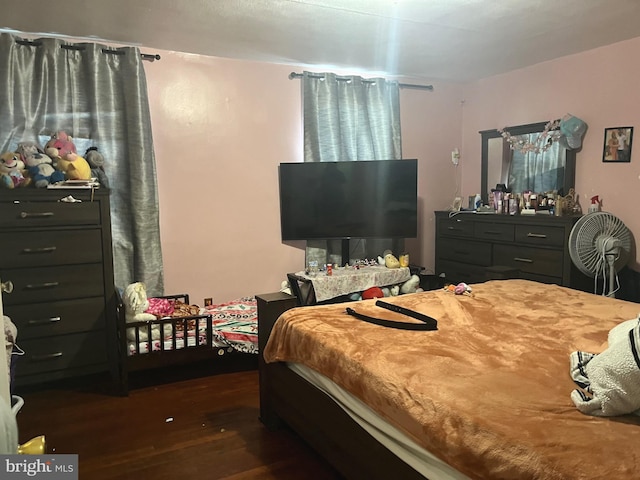 bedroom featuring dark wood-type flooring