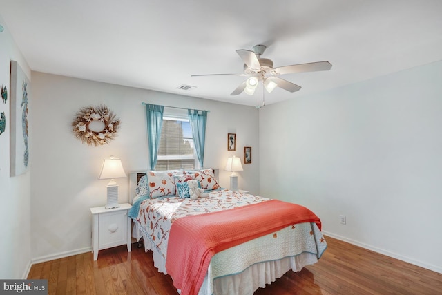 bedroom featuring hardwood / wood-style flooring and ceiling fan