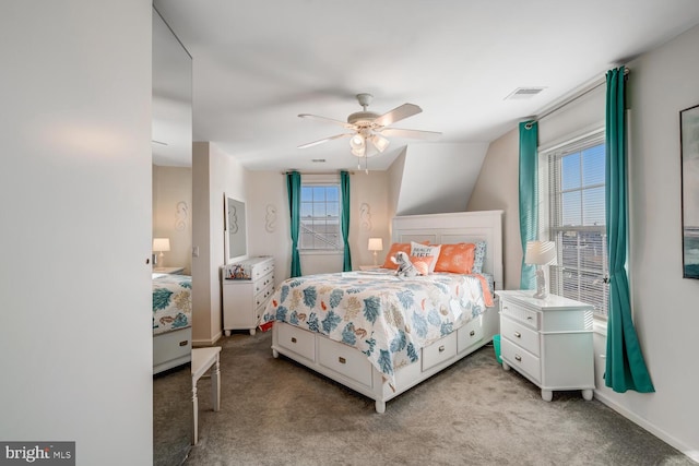 bedroom with ceiling fan, light carpet, and lofted ceiling