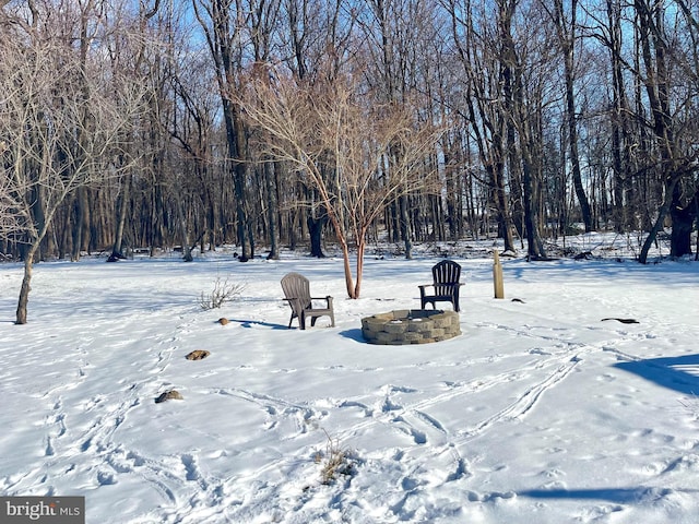 view of home's community featuring an outdoor fire pit