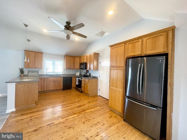 kitchen with ceiling fan, pendant lighting, lofted ceiling, black appliances, and light wood-type flooring