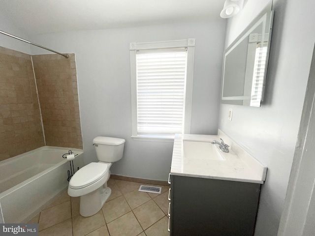 full bathroom featuring tile patterned flooring, vanity, tiled shower / bath combo, and toilet