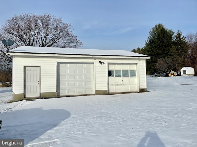 view of snow covered garage