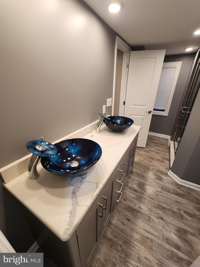 bathroom featuring vanity and hardwood / wood-style flooring