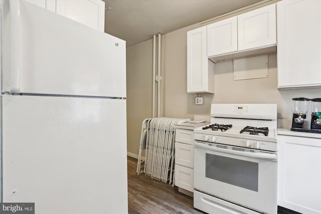 kitchen featuring white cabinetry, dark hardwood / wood-style flooring, and white appliances