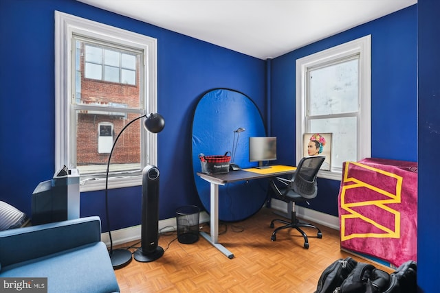 office with a healthy amount of sunlight and parquet floors